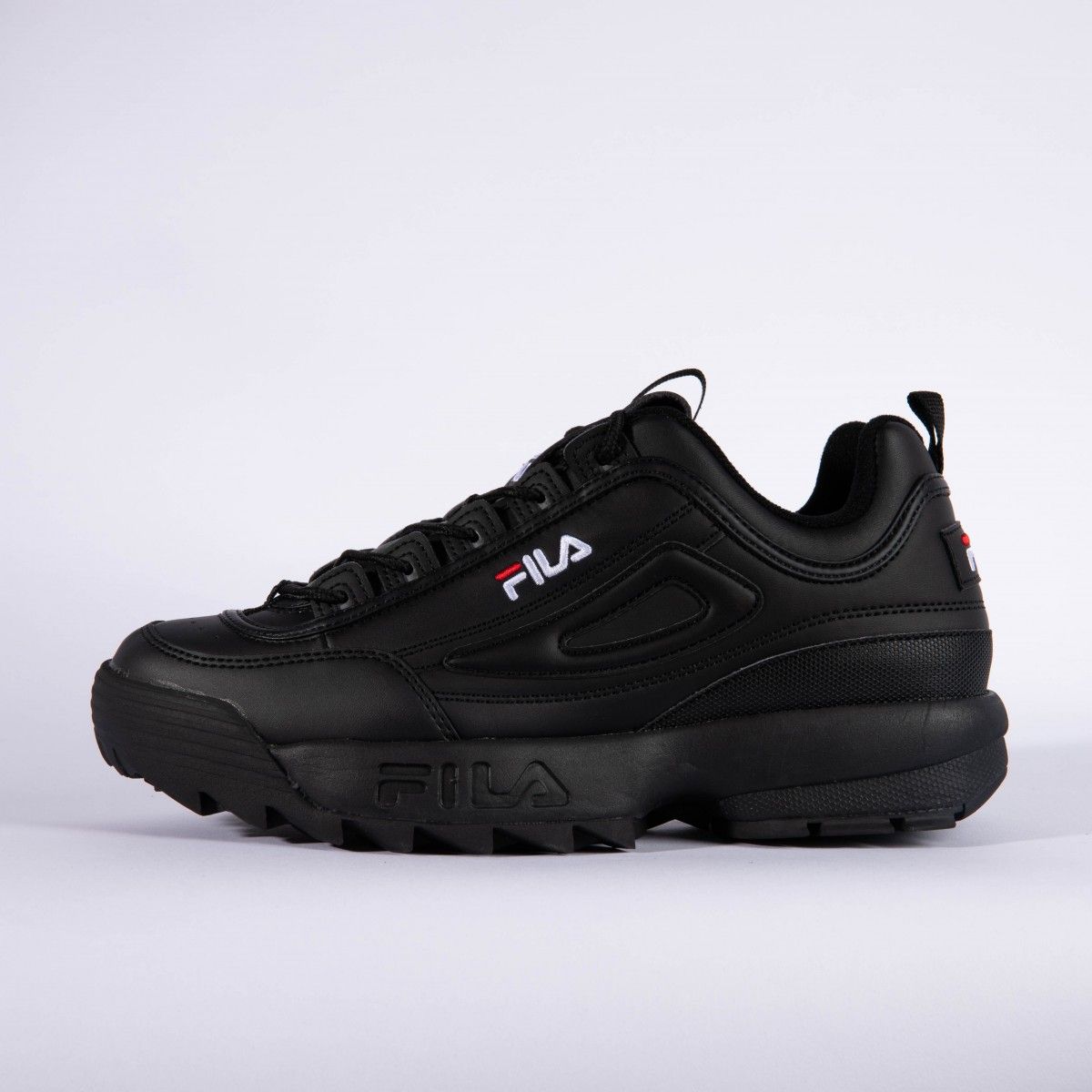 fila disruptor trainers in black